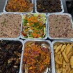 Oxtail Oven jerk chicken Escovitch fish Festival Rice and peas Toss sald Served for a group of 1 (2)