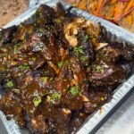 Oxtail Oven jerk chicken Escovitch fish Festival Rice and peas Toss sald Served for a group of 1 (3)